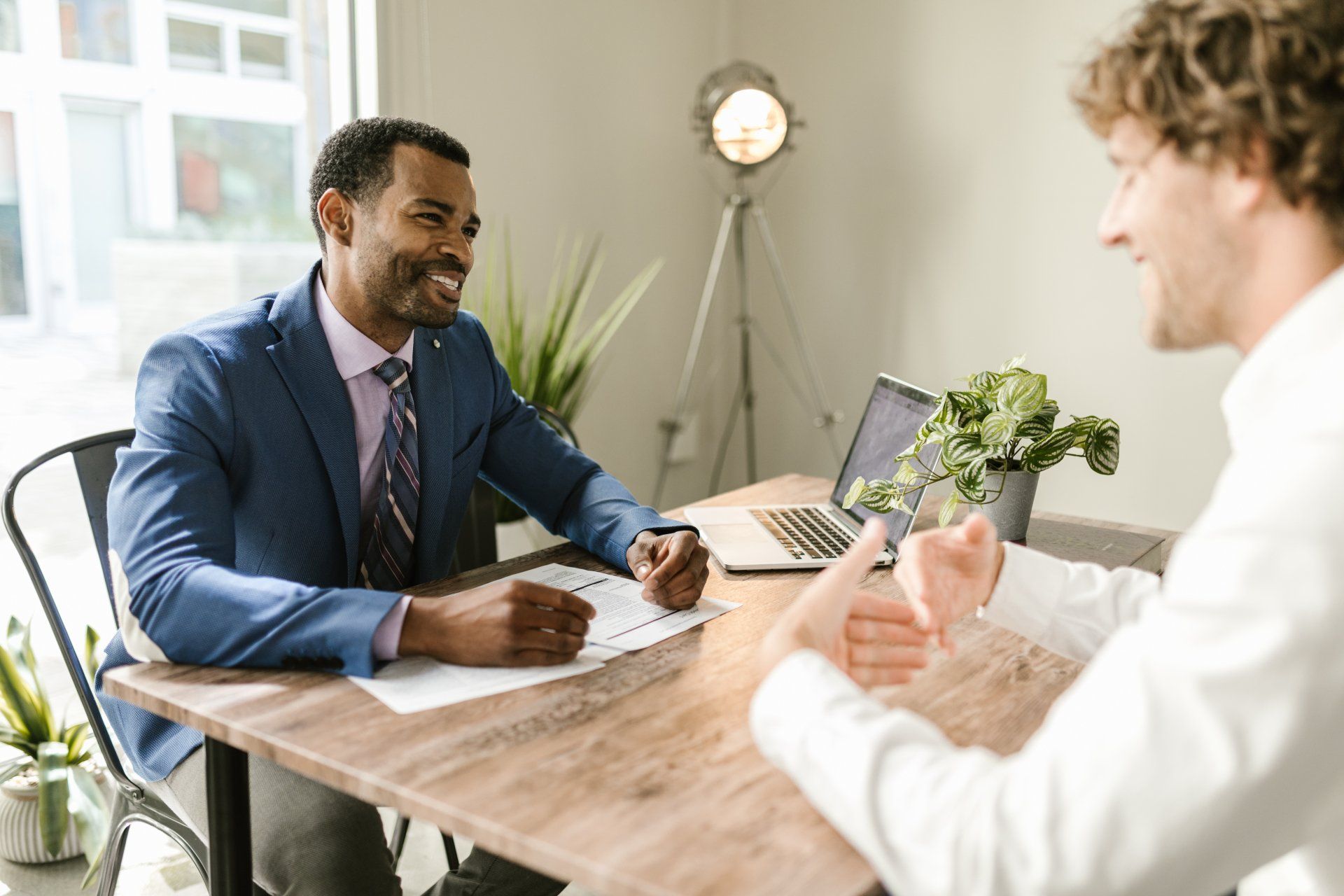 Business advisor reviewing a plan with a client